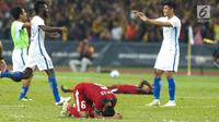 Pemain  Timnas U-22, Evan Dimas sujud setelah pertandingan Sepak Bola Indonesia melawan Malaysia di Stadion Shah Alam, Selangor, Sabtu (26/08). Indonesia kalah 0-1 dari tuan rumah Malaysia di Sea Games 2017. (Liputan6.com/Faizal Fanani)