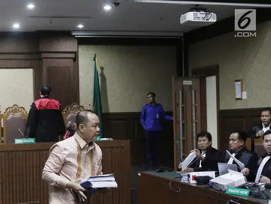 Terdakwa kasus penerbitan Surat Keterangan Lunas (SKL) BLBI Syafruddin Arsyad Temenggung saat menjalani sidang lanjutan di Pengadilan Tipikor Jakarta, Kamis (23/8).(Liputan6.com/Herman Zakharia)