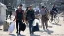 Israel juga memperingatkan warga di Gaza bahwa pasukannya akan menyerang area tersebut dengan kekuatan besar. (Bashar TALEB/AFP)