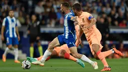 Atletico Madrid hanya mampu bermain 3-3 saat berlaga di kandang Espanyol. (Photo by Josep LAGO / AFP)