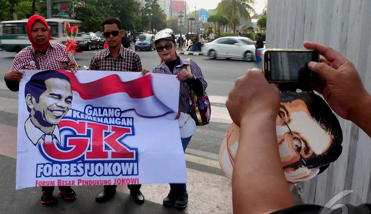 Aksi tersebut merupakan bentuk dukungan terhadap Jokowi dan Jusuf Kalla yang akan dilantik pada tanggal 20 Oktober 2014, Jakarta, (17/10/14). (Liputan6.com/Johan Tallo)