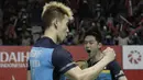 Ganda putra Indonesia, Kevin Sanjaya / Marcus Gideon, merayakan kemenangan atas ganda Jerman pada Indonesia Masters 2019 di Istora Senayan, Jakarta, Rabu (23/1). Kevin / Marcus lolos ke 16 besar. (Bola.com/M. Iqbal Ichsan)