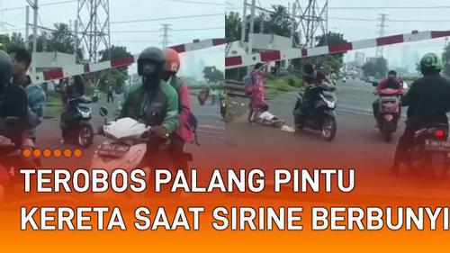 VIDEO: Kena Imbasnya, Pemotor Terobos Palang Pintu Kereta Saat Sirine Berbunyi