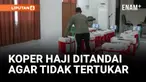 CALON JEMAAH HAJI ASAL LOMBOK TANDAI KOPER DENGAN FOTO DAN TALI PLASTIK AGAR MUDAH DIKENALI DAN TIDAK TERTUKAR