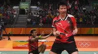 Ganda campuran Indonesia, Tontowi Ahmad/Liliyana Natsir, meraih medali emas pada Olimpaide Rio 2016. (AFP/Goh Chai Hin)