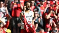 Selebrasi unik Cody Gakpo selepas membobol gawang Tottenham Hotspur dalam laga Premier League 2024/2025 di Anfield, Minggu (27/4/2025) malam WIB. (AFP/Paul Ellis)