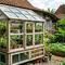 Cara membuat greenhouse mini dari jendela bekas. [Gemini AI]