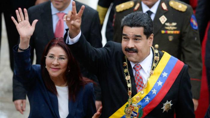 Presiden Venezuela Nicolas Maduro dan istrinya Cilia Flores (AFP Photo/Federico Parra)