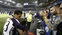 Reaksi Dani Alves usai Juventus kalah 1-4 dari Real Marid pada final Liga Champions 2016/2017. (ADRIAN DENNIS / AFP)