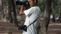 Miko tunadaksa asal Aceh yang sempat hidup dirundung rasa minder, kini jadi seorang fotografer dengan kemampuan mumpuni (Liputan6.com/Rino Abonita)