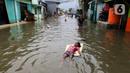 Wilayah yang mengalami banjir rob adalah tiga RT di Kelurahan Marunda dengan ketinggian air sekitar 40 cm, di Kelurahan Pluit dengan ketinggian air 80 sampai 90 cm. (Liputan6.com/Herman Zakharia)