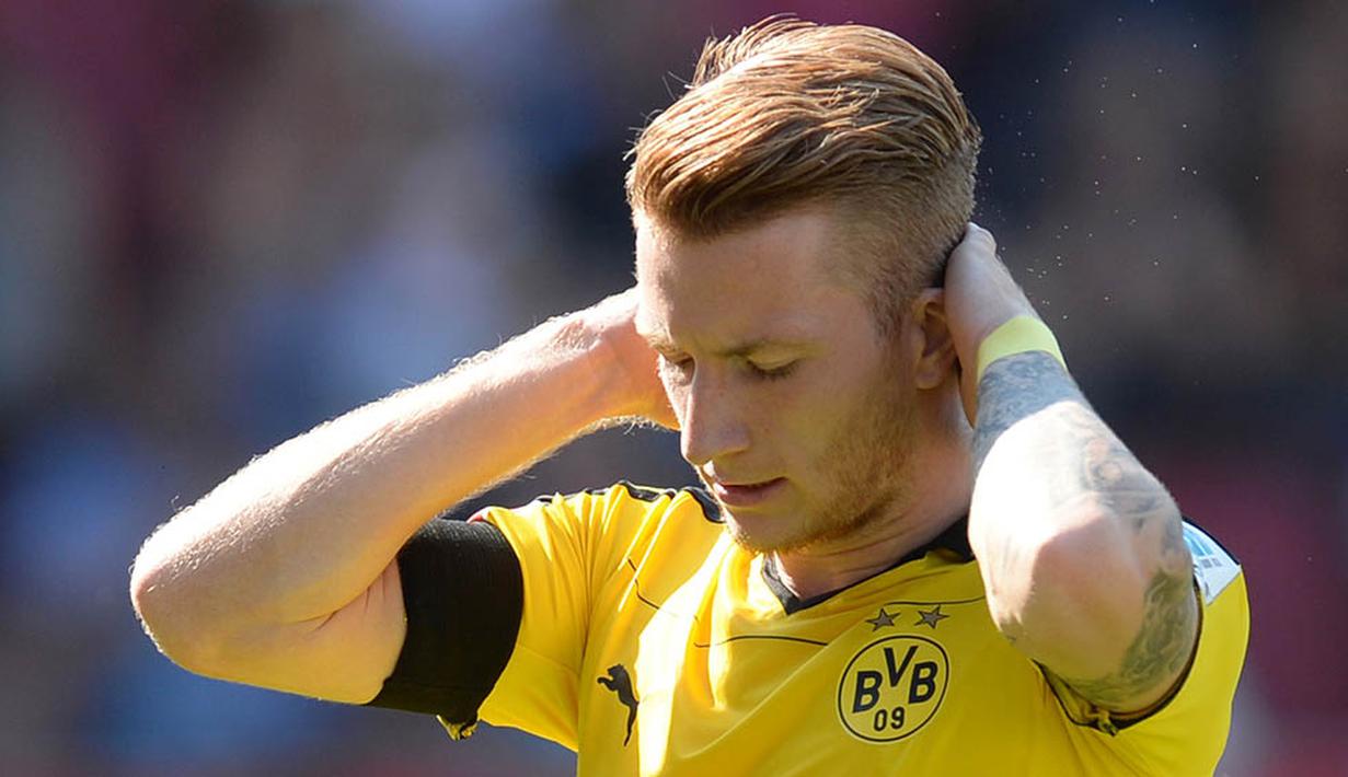 7. Marco Reus, gelandang yang memiliki kecepatan di atas rata-rata ini memilih gaya rambut flamboyan atau yang sering disebut fauxhawk. (AFP/Christof Stache)