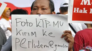 Sejumlah elemen masyarakat melakukan aksi menolak hasil UU Pilkada di Bundaran HI, Jakarta, (28/9/14). (Liputan6.com/Miftahul Hayat)
