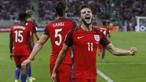 Gelandang Inggris, Adam Lallana, merayakan gol yang dicetaknya ke gawang Slovakia pada laga kualifikasi Piala Dunia 2018 di Stadion Antona Malatinskeho, Trnava, Slovakia, Minggu (4/9/2016). Inggris menang 1-0 atas Slovakia. (Reuters/Carl Recine)