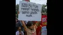 Dalam aksinya mereka menuntut rumah susun yang dijanjikan Jokowi, Jakarta, (22/9/14). (Liputan6.com/Faizal Fanani)