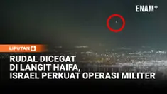 Pencegatan rudal terlihat di langit Haifa, Israel, pada dini hari ketika konflik antara Iran dan Israel terus meningkat. Kilatan ledakan di langit malam menunjukkan sistem pertahanan udara Israel mencegat serangan di tengah perang yang semakin meluas...