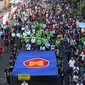 Menteri Luar Negeri Retno Marsudi dan Kemenaker Trans Hanif Dhakiri saat memimpin jalannya Parade Asean 50 Tahun di Jakarta, Minggu (27/8). Acara Parade ASEAN 50 tahun ini digelar oleh Kemlu. (Liputan6.com/Angga Yuniar)