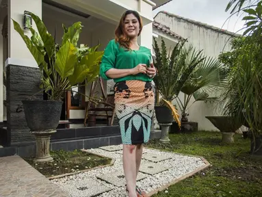 Informasi yang bersifat viral membuat nama Wina Lia (40), janda cantik asal Sleman, DIY, mendadak mendunia, Sleman, Rabu (11/3/2015).(AFP Photo/Suryo Wibowo)