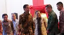 Presiden Jokowi dan rombongan saat tiba di Gedung Bursa Efek Jakarta untuk meresmikan sektor perdagangan saham perdana di Gedung Bursa Efek Jakarta, Jumat (2/1/2014).Jakarta, Jumat (2/1/2014).(Liputan6.com/Faizal Fanani)