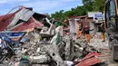 Otoritas setempat mengatakan 27 orang tewas di Kota Bogo, sementara korban tewas lainnya dilaporkan dari San Remigio dan kota-kota lain yang dekat dengan pusat gempa. (TED ALJIBE/AFP)