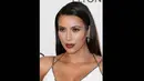 Bintang reality TV, Kim Kardashian pun sangat jarang mengumbar senyum dalam berbagai acara. Kabarnya, ibu dari North West itu mengurangi intensitas tersenyum demi menghindari keriput pada wajahnya. (Frederick M. Brown/Getty Images/AFP)