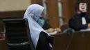 Tersangka dugaan korupsi dan tindak pidana pencucian uang terkait kepengurusan fatwa untuk Djoko Tjandra di Mahkamah Agung, Pinangki Sirna Malasari saat menjalani sidang di Pengadilan Tipikor Jakarta, Rabu (30/9/2020). Sidang beragenda pembacaan eksepsi. (Liputan6.com/Helmi Fithriansyah)