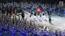 Kontingen Afghanistan melintas saat pembukaan Asian Games 2018 di Stadion Utama Gelora Bung Karno (SUGBK), Jakarta, Sabtu (18/8). Asian Games 2018 diikuti 45 negara. (Merdeka.com/Imam Buhori)