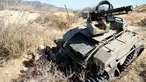 Tentara AS mengendalikan Multi-Utilitas Tactical Transport (MUTT) saat menggelar latihan militer Rim Pasifik (RIMPAC) 2016 di Camp Pendleton, Amerika Serikat, (13/7). MUTT merupakan tank kecil tanpa awak yang super canggih. (REUTERS / Mike Blake)