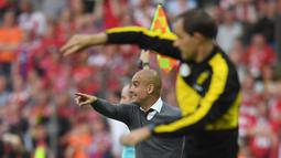 Ekspresi Bayern Munchen, Pep Guardiola, dan pelatih Borussia Dortmund, Thomas Tuchel, dalam final DFB Pokal di Olympiastadion Berlin, Sabtu (25/5/2016). (AFP/DPA/Bernd Thissen)