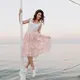Balletcore membawa elemen khas busana balerina seperti ballet flats, wrap cardigan, pita, dan rok tulle ke dalam outfit yang lebih modern. (Foto/Dok: Magnific)