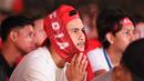 Raut muka kekecewaan suporter Garuda pada saat nonton bareng pertandingan Timnas Indonesia vs China di Kompleks Stadion Utama Gelora Bung Karno (SUGBK), Senayan, Jakarta, Selasa (15/10/2024) malam WIB. (Bola.com/Abdul Aziz)