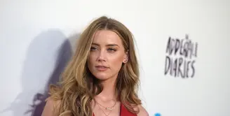 Amber Heard nampaknya enggan berlama-lama menikmati masa kesendiriannya, pasca berpisah dengan aktor kawakan, Johnny Depp. (AFP/Bintang.com)