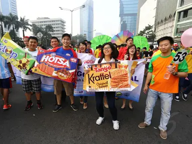 Orang Tua Group turut serta dalam Parade Simpatik Hari Pelanggan Nasional 2014 di Jakarta,  Minggu (7/9/14). (Liputan6.com/Johan Tallo)