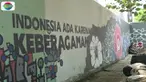 Pelukis mural ini berusaha mempersatukan bangsa Indonesia.