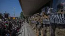 Hal itu menyusul pecahnya kerusuhan massa di Los Angeles imbas operasi penggerebekan imigrasi. (Apu GOMES/AFP)