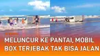 Sebuah mobil box terjebak di arus ombak pantai mengundang perhatian
