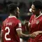 Selebrasi gelandang Timnas Indonesia, Marselino Ferdinan (tengah) bersama Yakob Sayuri setelah mencetak gol penyeimbang 1-1 ke gawang Timnas Irak pada laga pertama Grup D Piala Asia 2023 Qatar di Ahmad bin Ali Stadium, Al-Rayyan, Doha, Senin (15/1/2024). (AFP/Karim Jaafar)