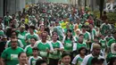 Ribuan peserta mengikuti lomba lari Milo Jakarta International 10K di kawasan Rasuna Epicentrum, Jakarta, Minggu (14/7/2019). Lomba ini digelar sebagai bagian dari perayaan Hari Ulang Tahun (HUT)  ke-492 DKI Jakarta. (Liputan6.com/Faizal Fanani)