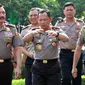  Kepala BIN Jendral Budi Gunawan dan Kapolri Jendral Tito Karnavian berjalan menuju Auditorium PTIK, Jakarta, Rabu (14/9). Polri melakukan tradisi penghantaran tugas Budi Gunawan sebagai Kepala BIN. (Liputan6.com/Helmi Afandi)