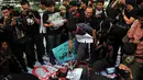 Sejumlah insan pers menggelar aksi solidaritas wartawan di Bundaran HI, Jakarta, Jumat (14/11/2014). (Liputan6.com/Johan Tallo)