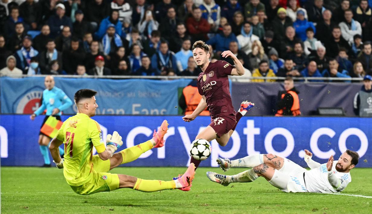 Empat gol kemenangan Manchester City di markas Slovan Brastislava dicetak oleh Ilkay Gundogan dan Phil Foden di babak pertama. Erling Haaland dan James McAtee menyumbang gol di babak kedua. (AFP/Joe Klamar)
