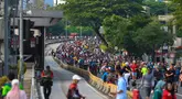 Warga menikmati suasana Hari Bebas Kendaraan Bermotor (HBKB) atau Car Free Day (CFD) di jalan Jenderal Sudirman, Jakarta, Minggu (7/9/2025). (Kapanlagi.com/Budy Santoso)