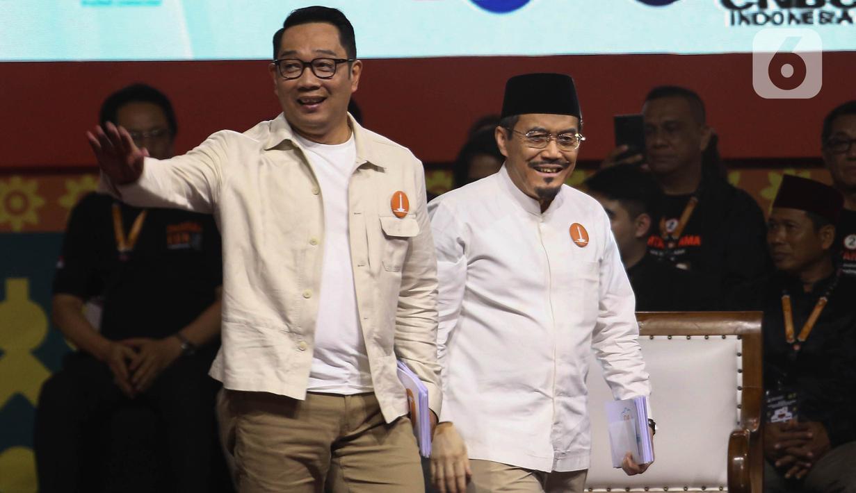 <p>Pasangan calon gubernur-wakil gubernur DKI Jakarta nomor urut satu Ridwan Kamil (kiri) dan Suswono saat debat kedua Pemilihan Gubernur DKI Jakarta pada Pemilihan Kepala Daerah (Pilkada) Serentak 2024 di Beach City International Stadium, kawasan wisata Ancol, Jakarta Utara, Minggu (27/10/2024). (Liputan6.com/Angga Yuniar)</p>