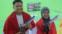 Prestasi gemilang dipersembahkan oleh duet M. Iqbal Raia Prabowo dan Arista Perdana Putri Darmoyo dari nomor Shooting 10 meter Air Pistol Mixed Team pada SEA Games 2025 Thailand. (Bola.com/Bagaskara Lazuardi)