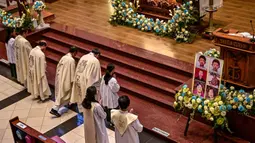 Misa peringatan ini menjadi bagian dari momen hening dan doa untuk para korban. (Juni KRISWANTO/AFP)