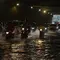 Pengendara sepeda motor menerjang banjir yang merendam terowongan di Cawang, Jakarta, Jumat (19/2/2021). Hujan yang turun sejak semalam membuat sejumlah jalanan di Ibu Kota tergenang banjir dengan ketinggian sekitar 30-50 cm. (merdeka.com/Imam Buhori)