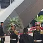 Presiden Joko Widodo (Jokowi) memakai pakaian adat Betawi berwarna hitam dibalut kain warna coklat dan peci hitam saat hadir dalam sidang tahunan MPR. (Tim Merdeka).