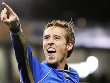 Portsmouth's English forward Peter Crouch celebrates after scoring during the English Premier league football match against West Bromwich Albion at The Hawthorns, on December 7, 2008. AFP PHOTO/ANDREW YATES