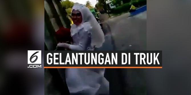 VIDEO: Aksi Pengantin Gelantungan di Truk yang Melaju