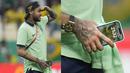 Detail menarik terlihat dari foto Neymar yang tengah menggenggam HP saat laga terakhir Grup G Piala Dunia 2022 antara Brasil melawan Kamerun di Lusail Stadium, Sabtu (03/12/2022) dini hari WIB. (AP/Natacha Pisarenko)